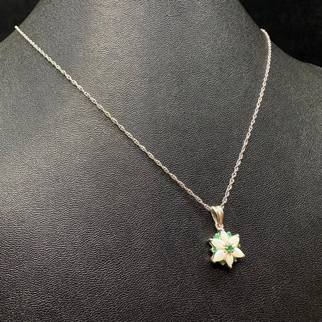 Sterling Silver Opal Emerald Flower Pendant: This piece of jewelry has been tested and researched prior to listing. Please view all our pictures they are part of our description. DETAILS: Metal - Sterling Silver Color - Silver Stones - none Hal