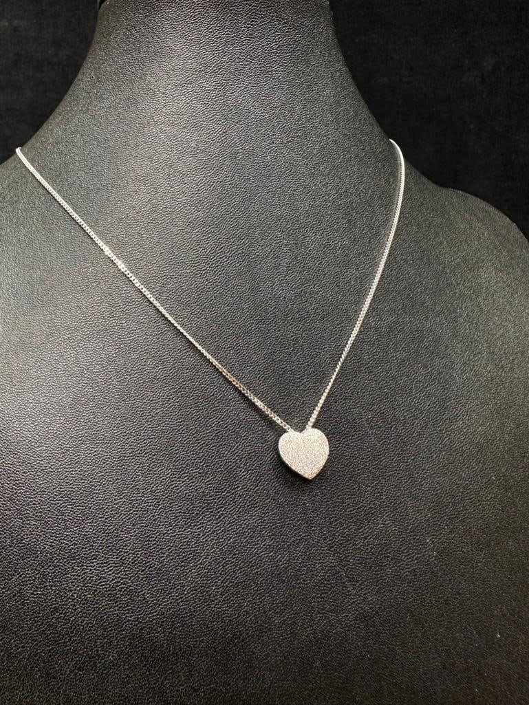 Sterling Silver Heart Pendant: This piece of jewelry has been tested and researched prior to listing. Please view all our pictures they are part of our description. DETAILS: Metal - Sterling Silver Color - Silver Stones - none Hall