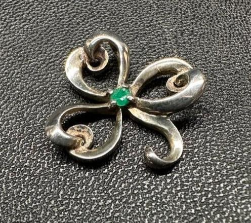Sterling Emerald Shamrock Pendant: This piece of jewelry has been tested and researched prior to listing. Please view all our pictures they are part of our description. DETAILS: Metal - Sterling Silver Color - Silver Stones - Emerald