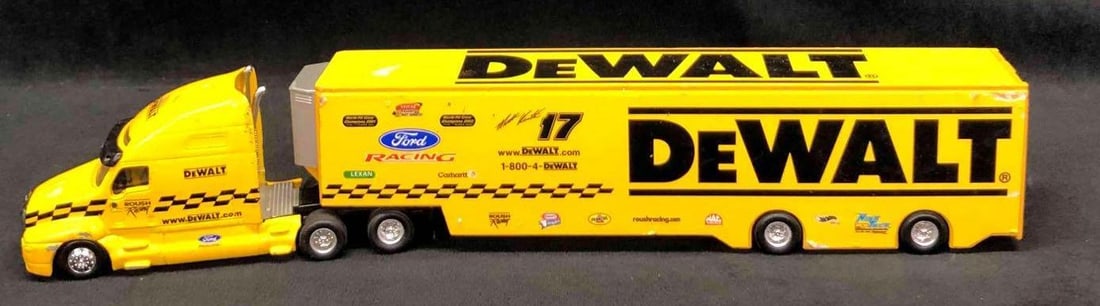 2004 Hot Wheels Matt Kenseth Team Transporter: This lot contains a 2004 Hot Wheels Matt Kenseth team transporter toy truck. The truck is made of die-cast. The truck is approx 14 1/2" x 1 3/4" x 2 3/4" and weighs about 0.7lbs. The truck