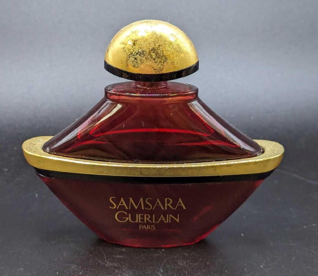Samsara By Guerlain Paris 1 fl oz Parfum: Samsara By Guerlain Paris 1 fl oz Parfum. This is approx 4" x 1" x 3 3/8" and it weighs 0.32lb. The bottle is a little more than halfway filled. The bottle has some wear on the trim and to