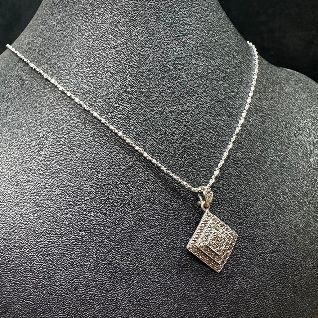 Sterling Silver Concentric Square Marcasite Pendant Necklace: This piece of jewelry has been tested and researched prior to listing. Please view all our pictures they are part of our description. DETAILS: Metal - Sterling Silver Color - Silver Stones - none Hall