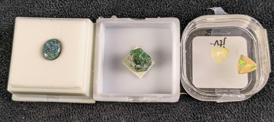 Lab Grown Rough Zambia Emerald Opal And Triplet Opal: This lot includes: (1) Opal Triplet. This is approx 8mm x 10mm x 2.9mm. (2) Opals. These are approx 9mm x 9mm x 1.9mm. (1) Rough Zambia Emerald 9.8mm x 10.2mm x 8.88mm All are in a good, unused