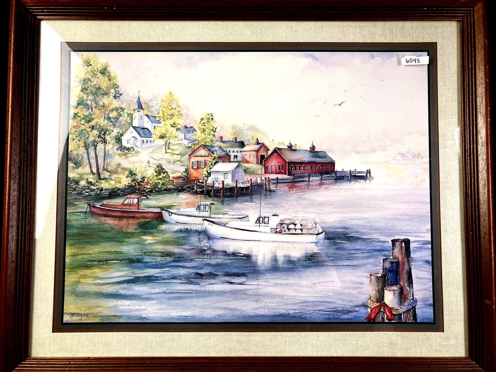 Watercolor "Lobster Hut" Print: Up for auction is a recent estate find. A watercolor copy of a painting done by an artist named Milligan. The work depicts a coastal village with boats and seaside houses. It is displayed inside a fra