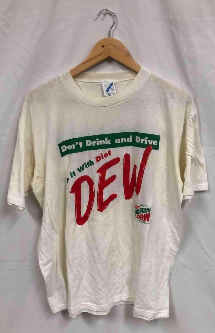 Vintage Diet Mountain Dew T-Shirt Don't Drink And Drive: This lot contains Vintage Diet Mountain Dew T-Shirt Don't Drink And Drive. Made in The U.S.A. Jerzees Brand. 50% Cotton 50% Polyester. The shirt is a size XL (Extra Large 46) and it weighs about 0