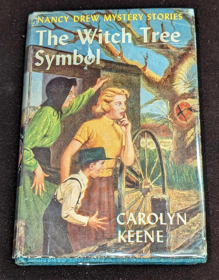 Nancy Drew #33 "The Witch Tree Symbol" 1955 Dust Jacket First Edition: Nancy Drew #33 "The Witch Tree Symbol" 1955 Dust Jacket. This is approx 5 1/2" x 1" x 7 3/4" and it weighs 0.65lb. The dust jacket has some shelf wear. This was written by Carolyn 