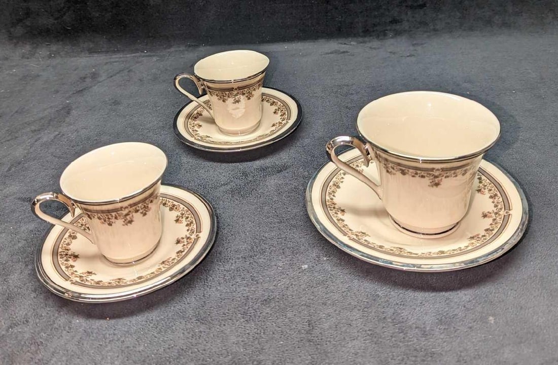 3 Retired Lenox Fine China Lace Point Cups & Saucers: 3 Retired Lenox Fine China Lace Point Cups & Saucers. This lot includes: (2) Footed Demitasse Cups. Each is approx 3 5/8" x 2 3/4" x 2 1/2". (2) Saucers. Each is approx 4 7/8" x 4