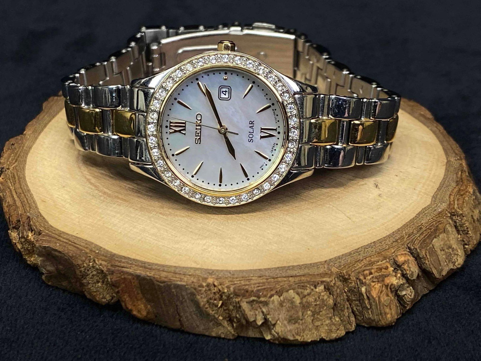 Seiko Ladies Modern Two Tones Mother of Pearl Dial Solar Watch: Condition: Working Pre-owned: An item that has been used previously. The item may have some signs of cosmetic wear, but ... Bezel Color: Gold, Silver Indices: Roman Numerals, Stick Indexes<
