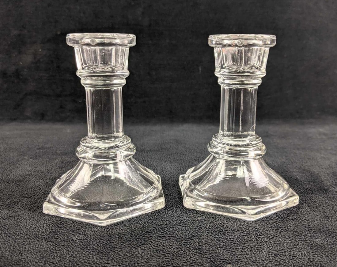 Glass Candlestick Holders: Glass Candlestick Holders These are elegant clear glass candlestick holders. These take long candlesticks and are the perfect centerpieces. These are pressed glass in good condition approx: 4 1/3in ta