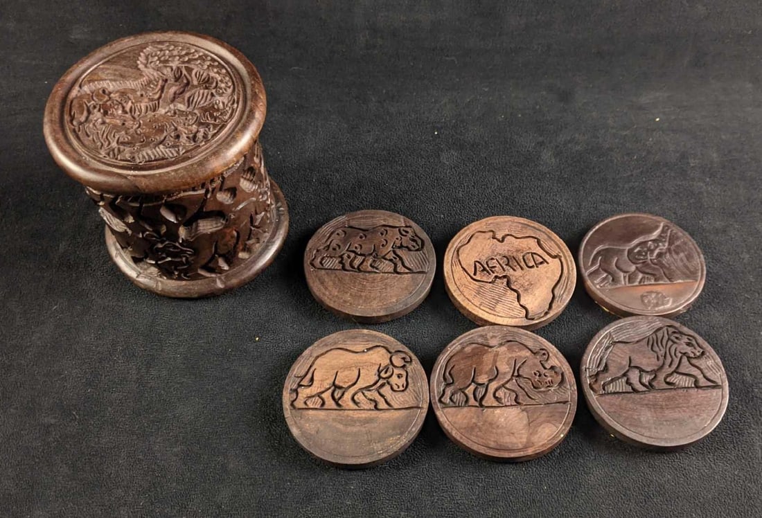 Hand Made Coasters Wooden Africa Coasters: Hand Made Coasters Wooden Africa Coasters This is a set of six wooden hand-carved wooden coasters in a very ornate holder, the coasters are carved with elephants, rhino's, lions, and a map of Afri