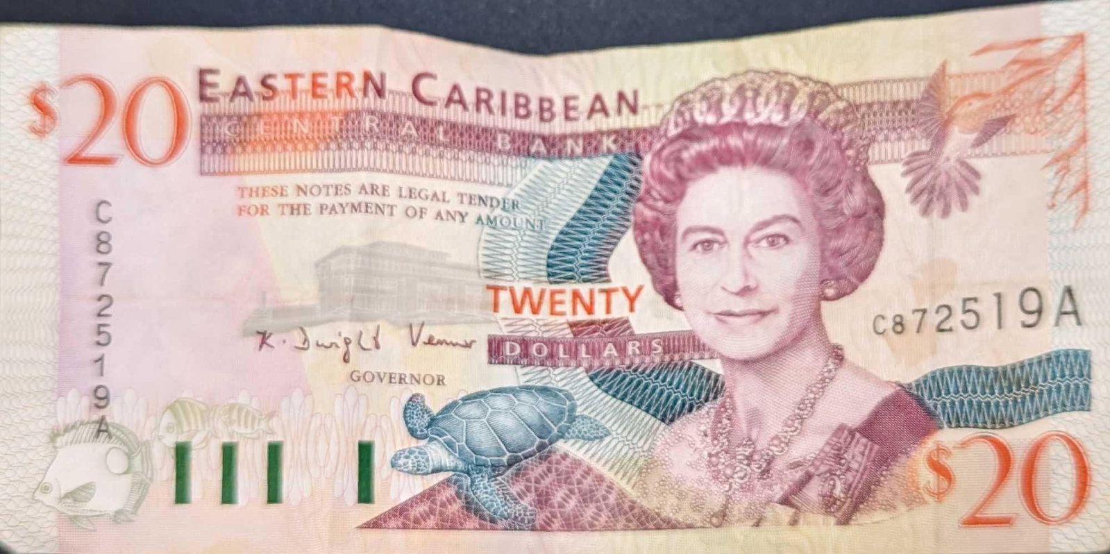 East Eastern Caribbean St Vincent $20 Paper Bill: East Eastern Caribbean St Vincent $20 Paper Bill. Is approx 5 5/8" x 2 3/4" and it weighs 0.01lb. The bill has creases and wrinkles. Please see the images as they are part of the description.