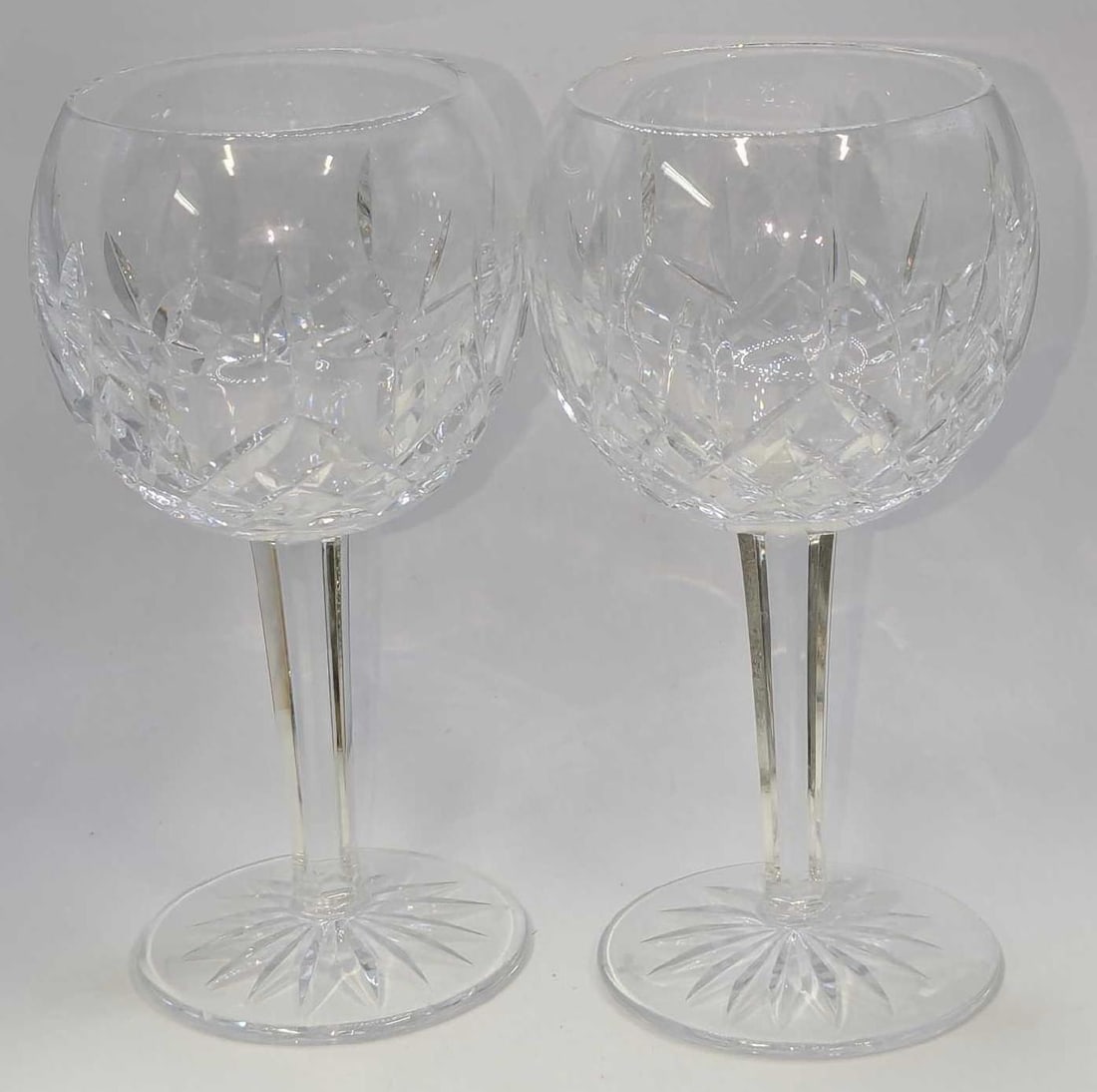 2 Waterford Crystal Lismore Balloon Wine Glasses E: 2 Waterford Crystal Lismore Balloon Wine Glasses E. Each is approx 4"x 4" x 7" and the total weight is 1.84lb. The glasses have no chips or cracks.