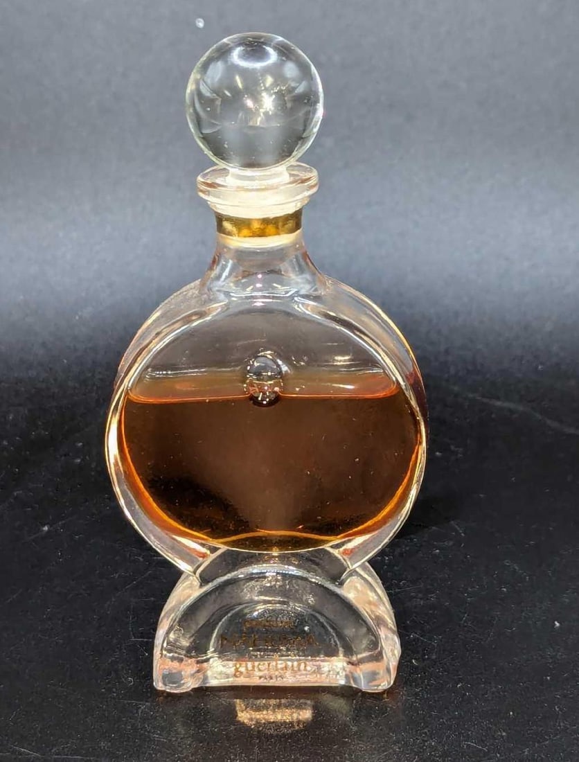 Nahema By Guerlain 15 ml Pure Parfum Extrait: Nahema By Guerlain 15 ml Pure Parfum Extrait.The bottle is approx 1 7/8" x 3/4" x 3 3/4" and it weighs 0.17lb. The bottle is a little more than halfway filled.