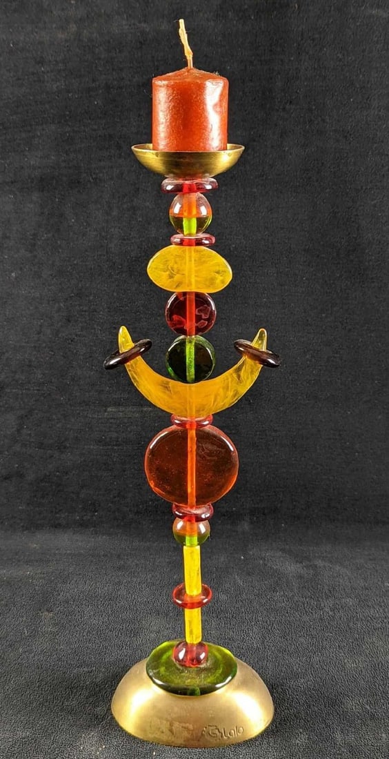 Brass Acrylic Vintage Orna Lalo Candlestick: Colorful candlestick with a brass base topped with colorful acrylic pieces that lead up to a brass holder for the candle. The candlestick is approx 5" x 3" x 16". Is in good, used conditio