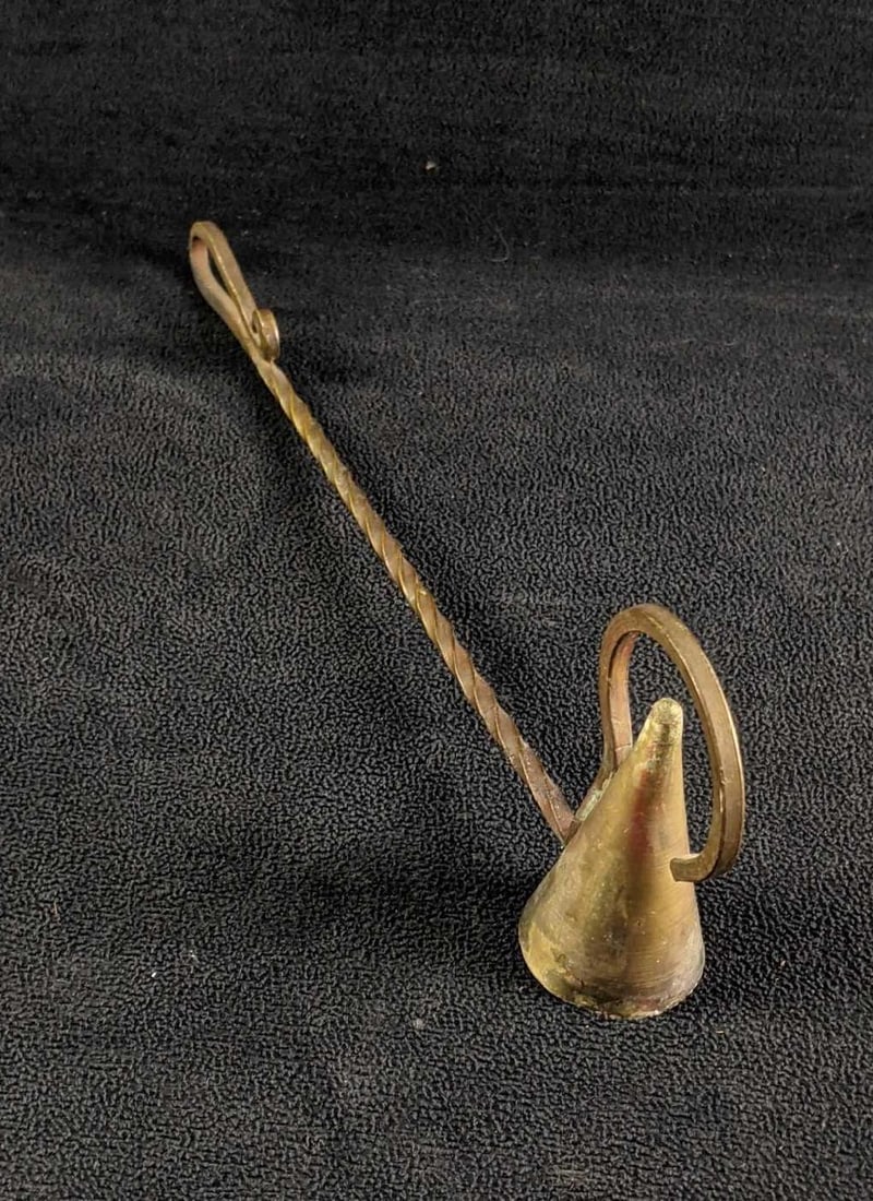 Brass Candle Extinguisher: Brass Candle Extinguisher This bras candle extinguisher is in good condition besides some tarnish. is has a long handle ensuring one does not burn themselves on a candle flame and a nice cone-shaped t
