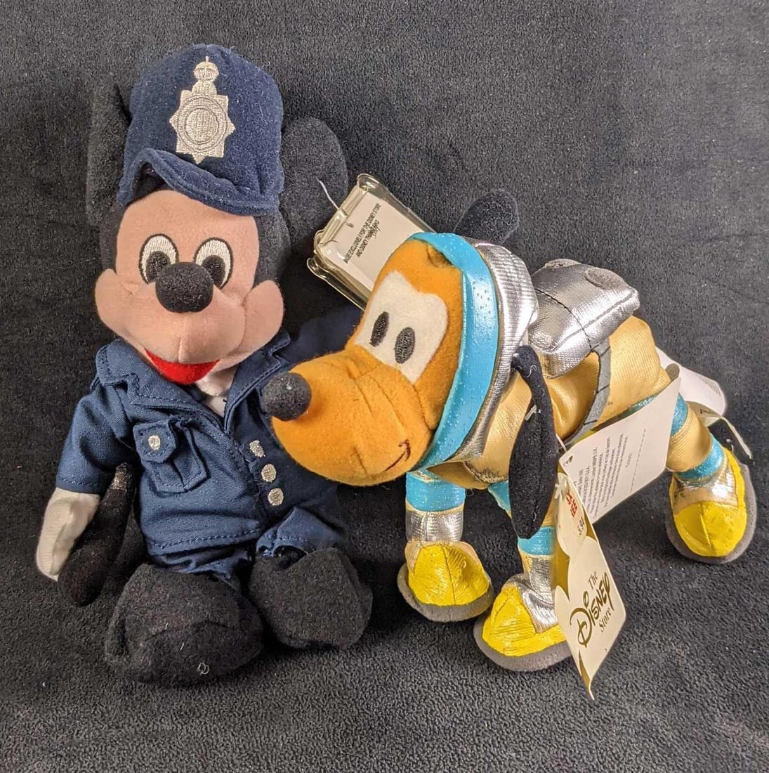 Disney Bean Bag Dolls Policeman Mickey Pluto Astronaut: This lot includes: (1) UK Exclusive Policeman Mickey Mouse. This is approx 6" x 4" x 10". Bean bag doll has some wear. (1) Pluto Astronaut. Is approx 8" x 3" x 7". The bean ba