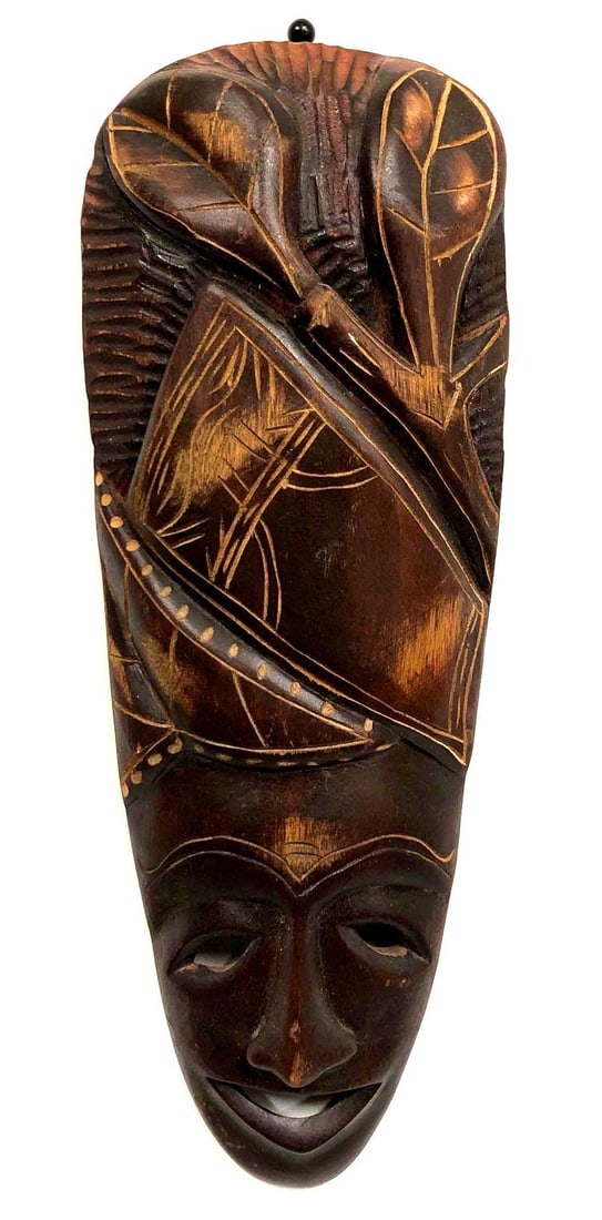 Handmade African Carved Wood Tribal Mask: Handmade African Carved Wood Mask. Item has a hook for hanging on wall. The mask is approximately 18" x 7" x 1-1/2" and weighs about 1.0lbs. Overall the Handmade Mask is in good used condi