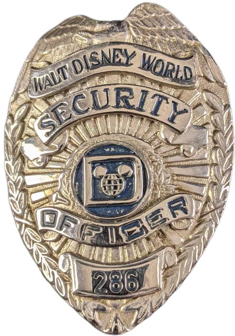 1970s/1980s Disney World Security Metal Badge: 1970s/1980s Disney World Security Metal Badge. Is approx 2 1/4" x 3/4" x 3" and it weighs under one pound at 0.12lb. The metal badge is in a good, vintage condition with some wear and mini