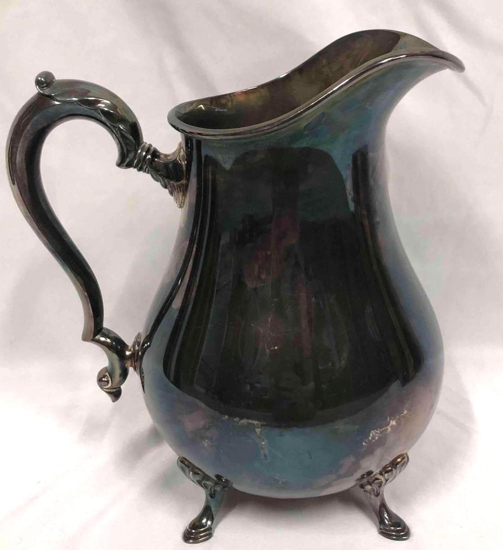 International Silver Company 7317 King George Pitcher: This lot contains an International Silver Company King George 7317 pitcher. The bottom of the pitcher is engraved with the companies logo. This pitcher was first introduced in 1921 and named after Kin