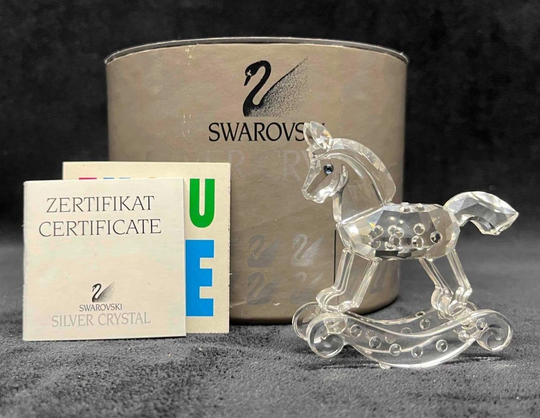 Swarovski Rocking Horse Figurine #7479 With Original Box & Certificate: This lot contains a Swarovski Rocking Horse Figurine #7479 With Original Box & Certificate. Approx weight and measurements are listed below. Overall the Swarovski Rocking Horse is in excellent use