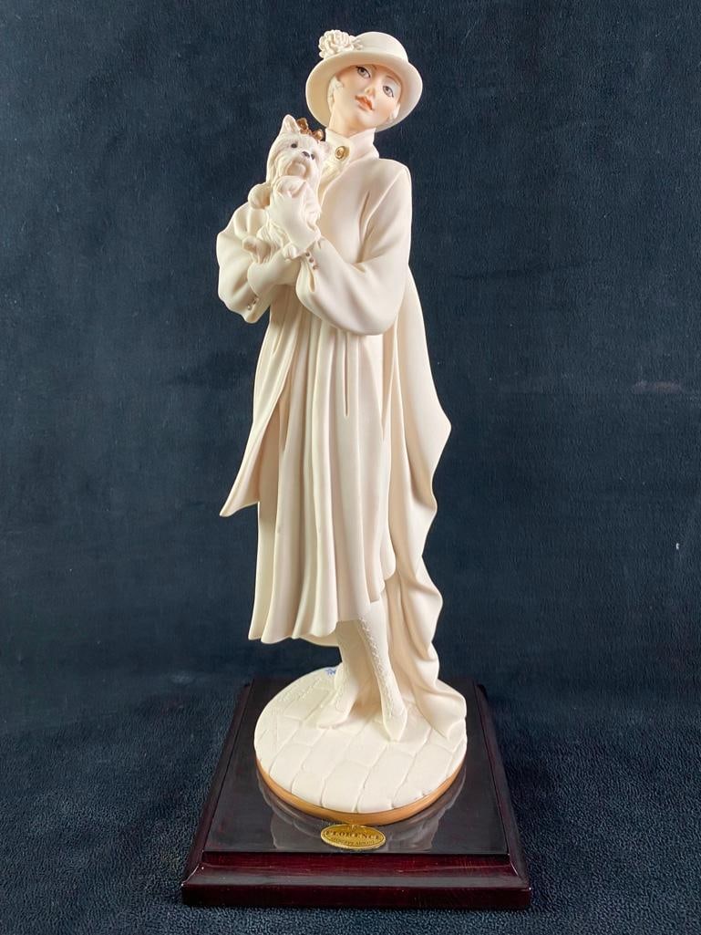 Giuseppe Armani "Young Lady With Yorkshire" Statue: Giuseppe Armani "Young Lady With Yorkshire" Statue Young Lady With Yorkshire is a statue of a woman in an overcoat holding a Yorkshire Terrier by Giuseppe Armani. In very good condition with n