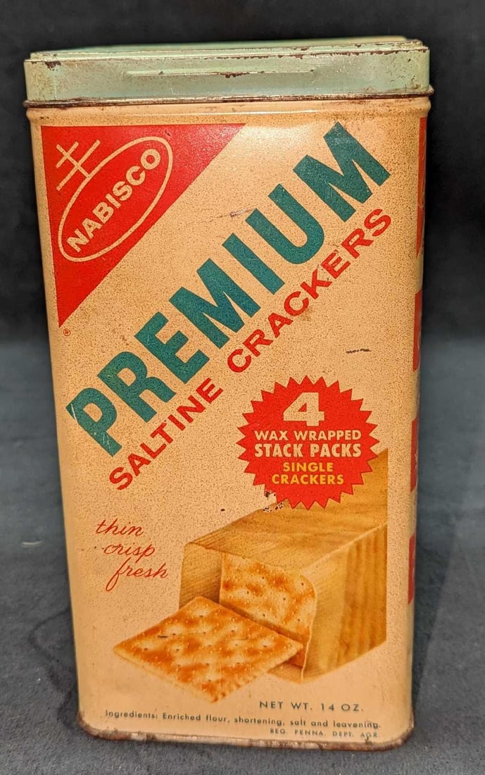 Vintage Premium Saltine Cracker Tin: Vintage Premium Saltine Cracker Tin. Is approx 4 1/2" x 4 1/2" x 9" and it weighs 0.63lb. The tin has some markings and discoloration. Please see the images as they are part of the descrip