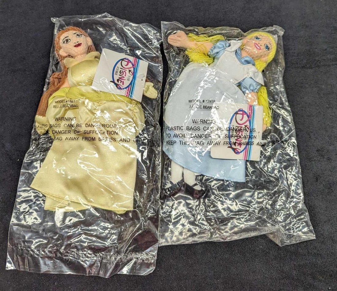 Sealed Disney Store Belle & Alice Bean Bag Dolls B: Sealed Disney Store Belle & Alice Bean Bag Dolls B. Both dolls are factory sealed in a plastic bag that is approx 7" x 2" x 11 1/2" and the total weight is 0.37lb. There is a rip on th