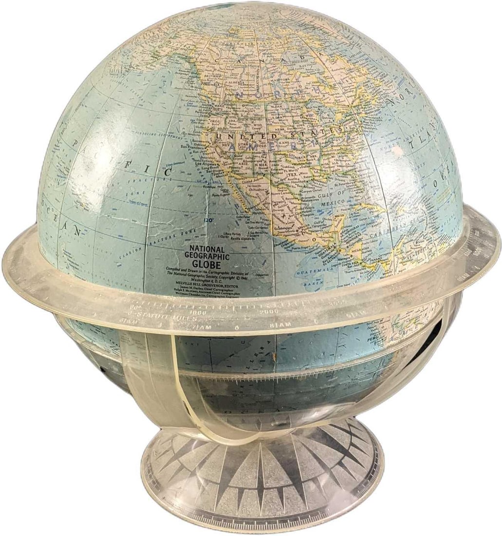 National Geographic World Globe With Acrylic Stand 1961: National Geographic World Globe With Acrylic Stand From 1961. Is approx 16 x 16" x 15" and it weighs 2.75lbs. The globe is in a good, vintage condition with the middle acyclic plate that goes