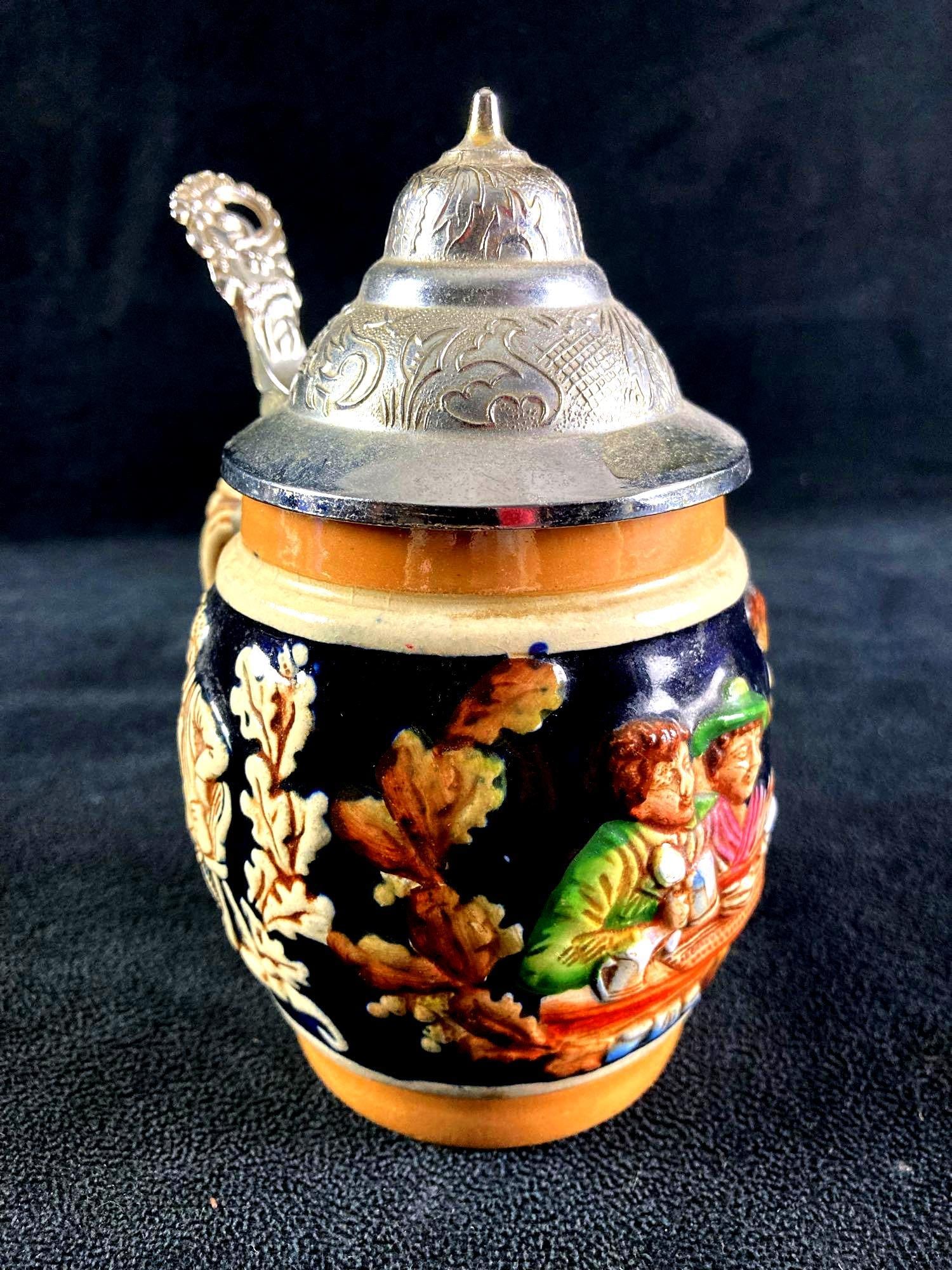 Miniature Beer Stein Made in West Germany: This lot includes: (1) Miniature Beer Stein Made in West Germany Condition is used and refer to photographs for additional details. The beer stein has a small brass liner on the i