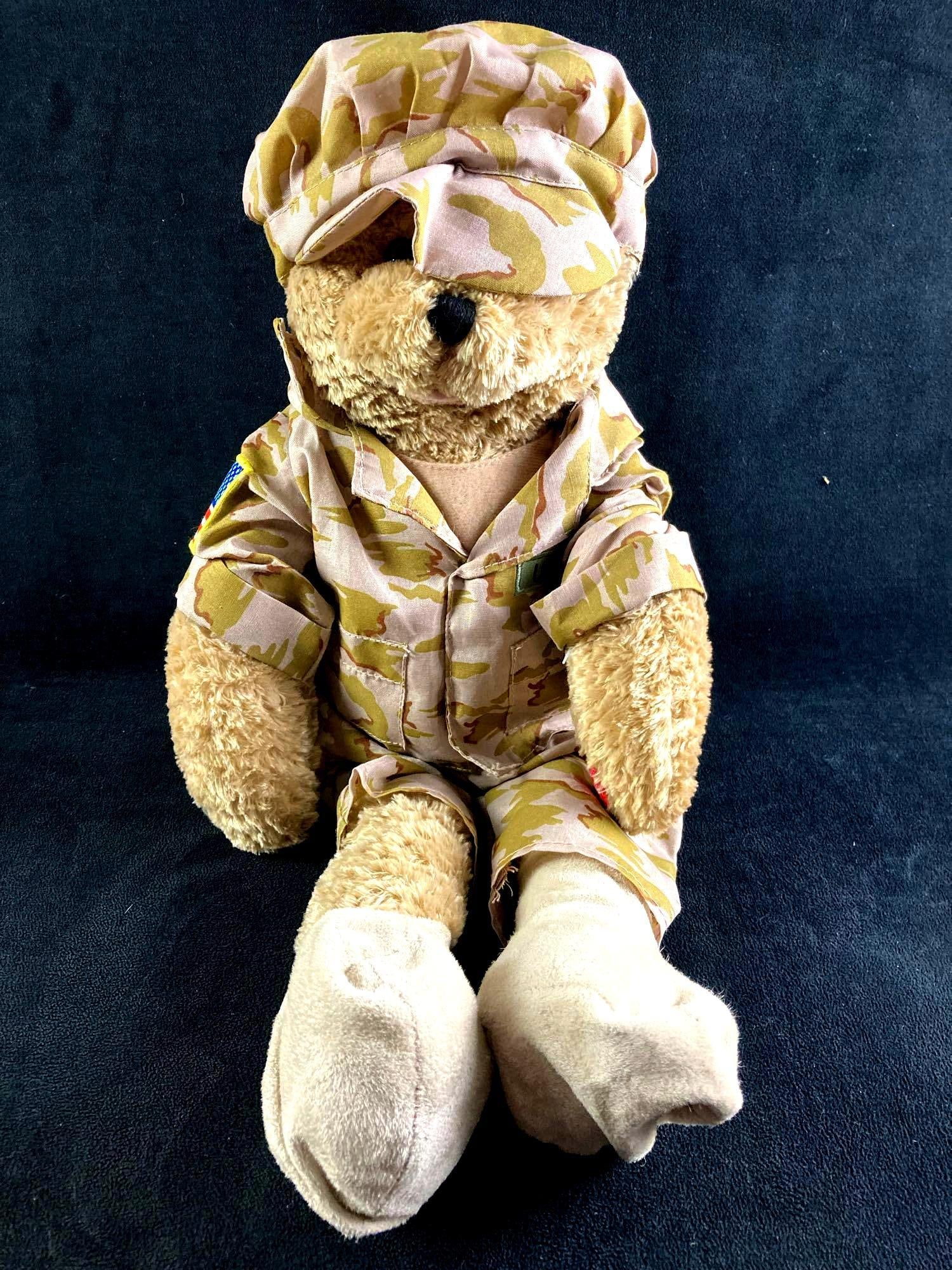 U.S. Army Battery Operated Bear Soldier "God Bless America": This lot includes: (1) U.S. Army Singing Bear Soldier "God Bless America" Condition is used and see photographs for additional details. The bear is dressed as a U.S. Army s