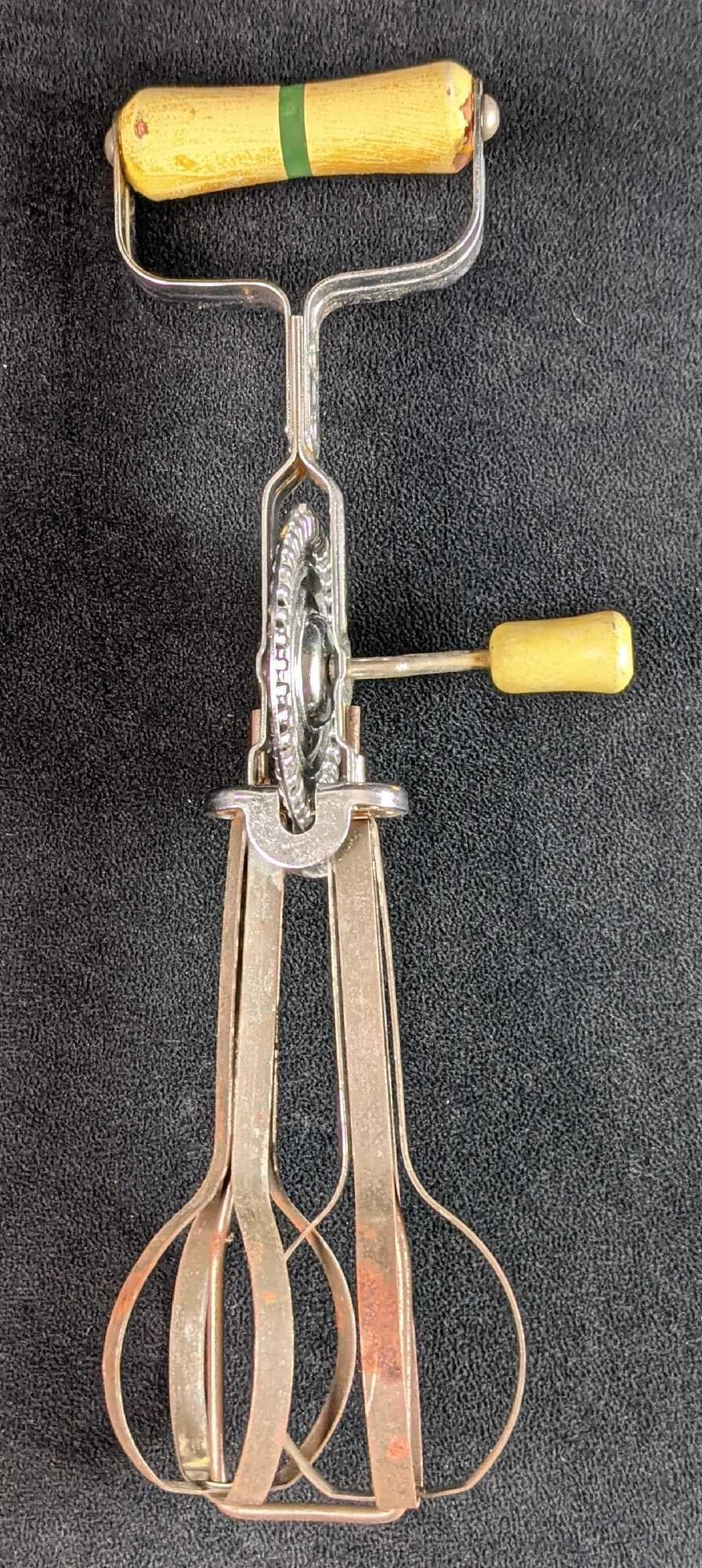 Vintage Androck Hand Mixer: Vintage Androck Hand Mixer. Wooden handles and metal body. Made in America. Is approx 12" long and is in good, vintage condition with some surface rust and wear/chips on the handles. Runs very wel
