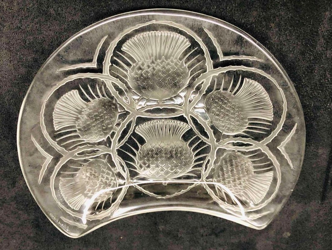 Signed Lalique Chardon Thistle Plate: This lot contains a Signed Lalique Chardon Thistle Plate. Its plate is approx 7 1/2" x 8" x 1" and it weigh about 1.2lbs. Overall the Lalique Plate is in good used condition with some ligh