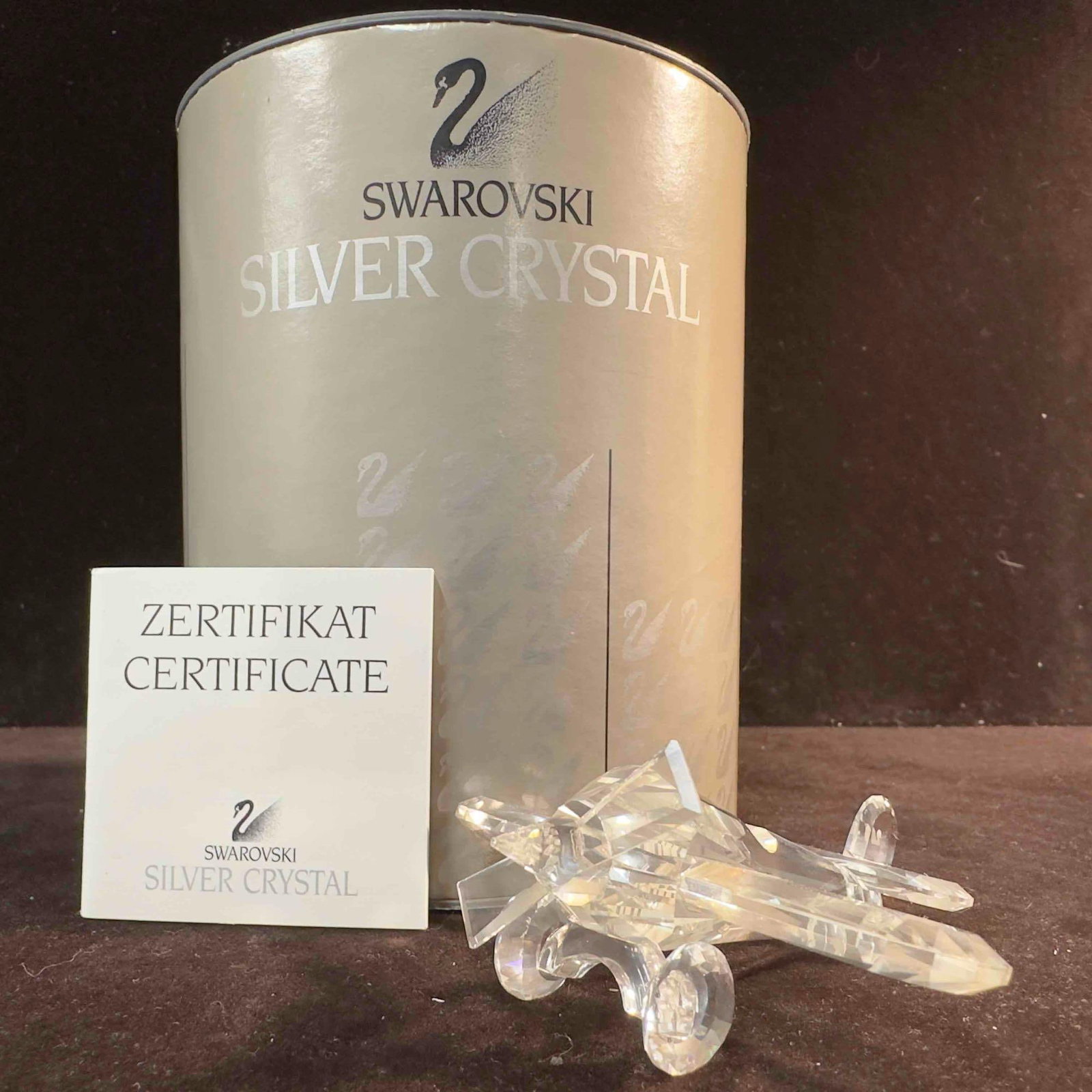 Swarovski Silver Crystal Figurine Airplane 7473 002: Swarovski Crystal Figurine Airplane. This figure is a beautiful crystal Airplane from Swarovski Crystal. The item is in great pre-owned condition with no noticeable damage. The item includes original 