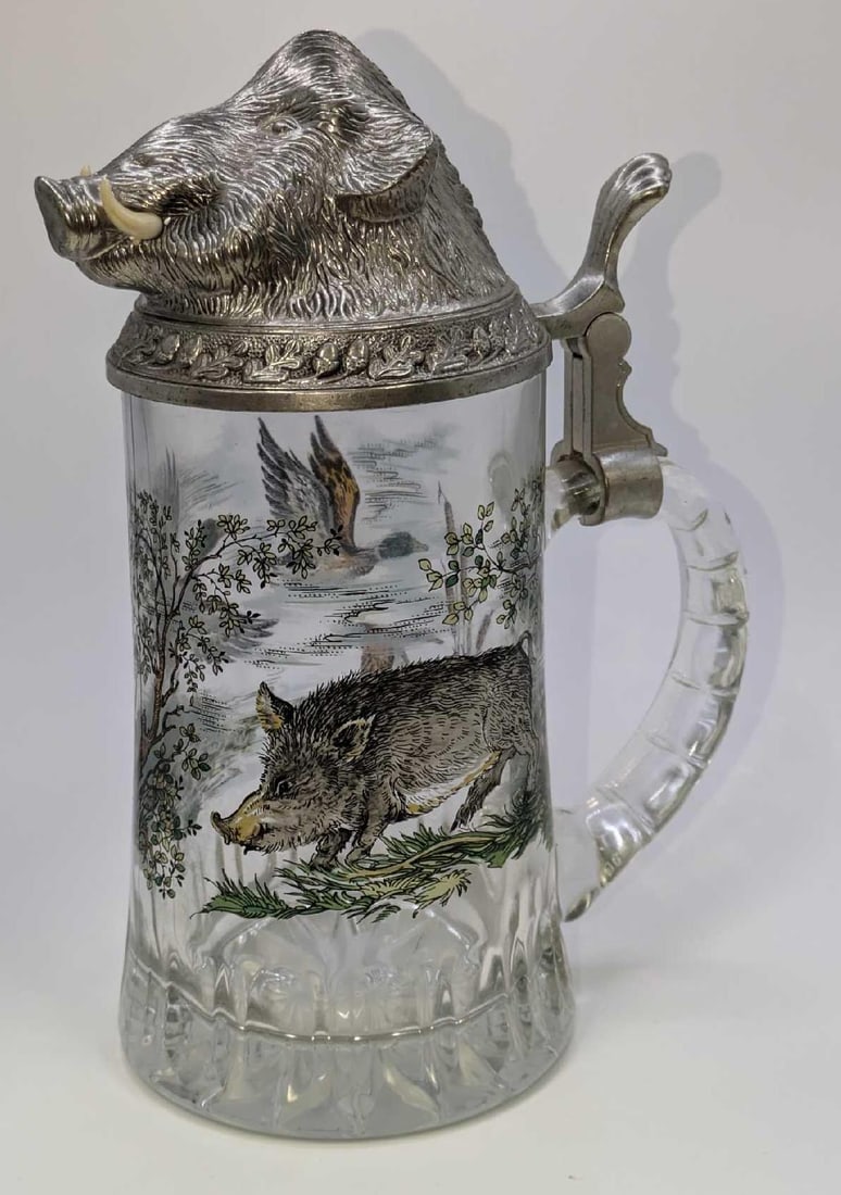 West German BMF Pewter Boars Head Lid Glass Stein: West German BMF Pewter Boars Head Lid Glass Stein. This is approx 6"x 3 3/4" x 8" and it weighs 2.23lbs. One of the tusks has a extra bit of material sticking out.