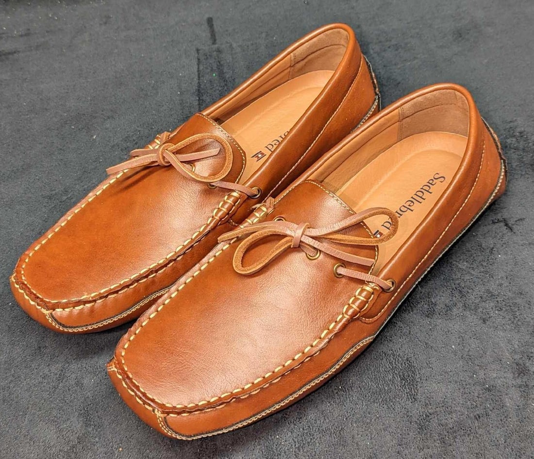 Saddlebred Tan Benet Slip On Shoes Men's 11.5: Saddlebred Tan Benet Slip-On Shoes Men's 11.5. New In box. The shoes are made of a man-made material. It comes in the original box that is approx 13 3/4" x 7 1/2" x 4 1/2" and it weigh