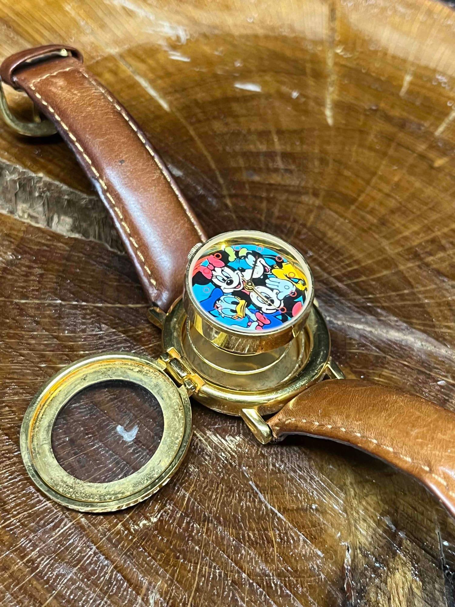 Disney's Toontown Pop Up Watch Mickey Inc.: This lot contains a Disney's Toontown Pop Up Watch Mickey Inc. It is approx 9" x 1 1/2" x 1/2". Total weight is 1.5oz. Overall the Toontown watch is in good used condition with some no
