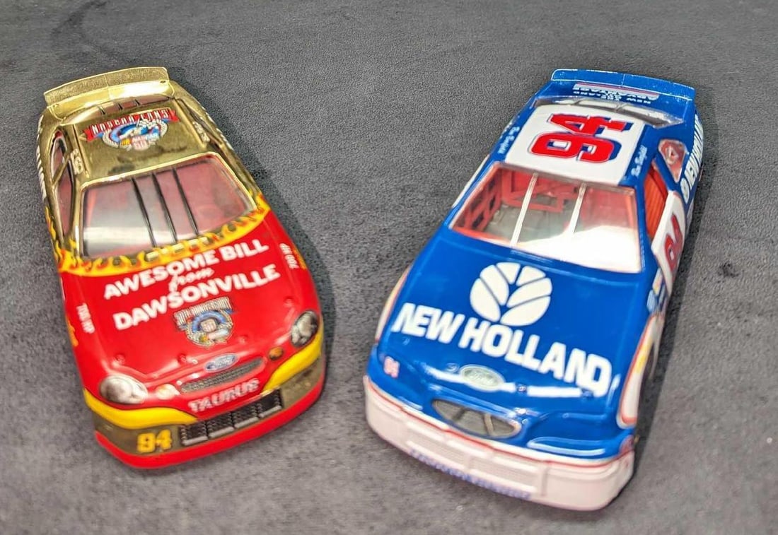 2 1/24th Diecast Bill Elliott & Ron Barfield Stock Cars: 2 1/24th Diecast Bill Elliott & Ron Barfield Stock Cars This lot includes: (1) Racing Champions 1/24th Diecast Bill Elliott "Awesome Bill From Dawsonville" NASCAR Fans Stock Car. This is a
