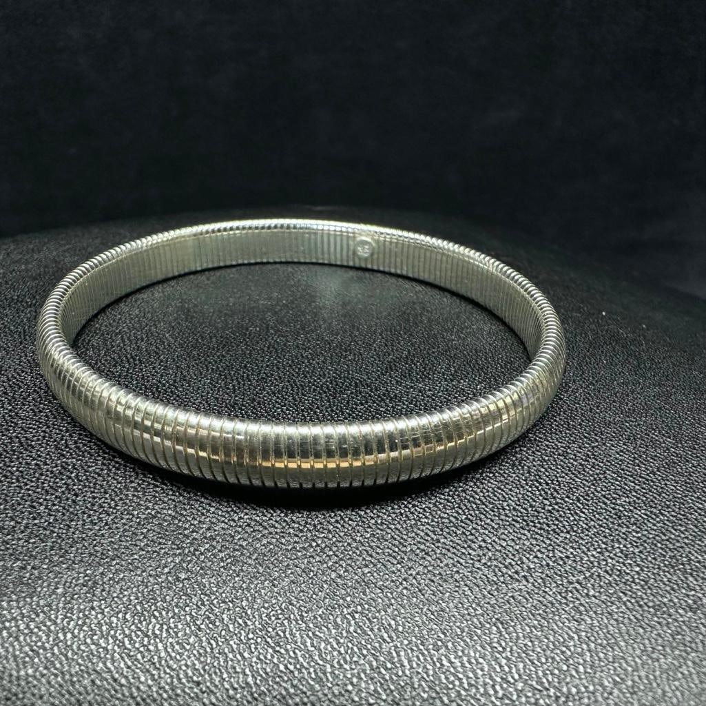 Sterling Silver Snake-Link Bangle Bracelet: This piece of jewelry has been tested and researched prior to listing. Please view all our pictures they are part of our description. DETAILS: Metal - Sterling Silver Color - Silver Stones - none Hall