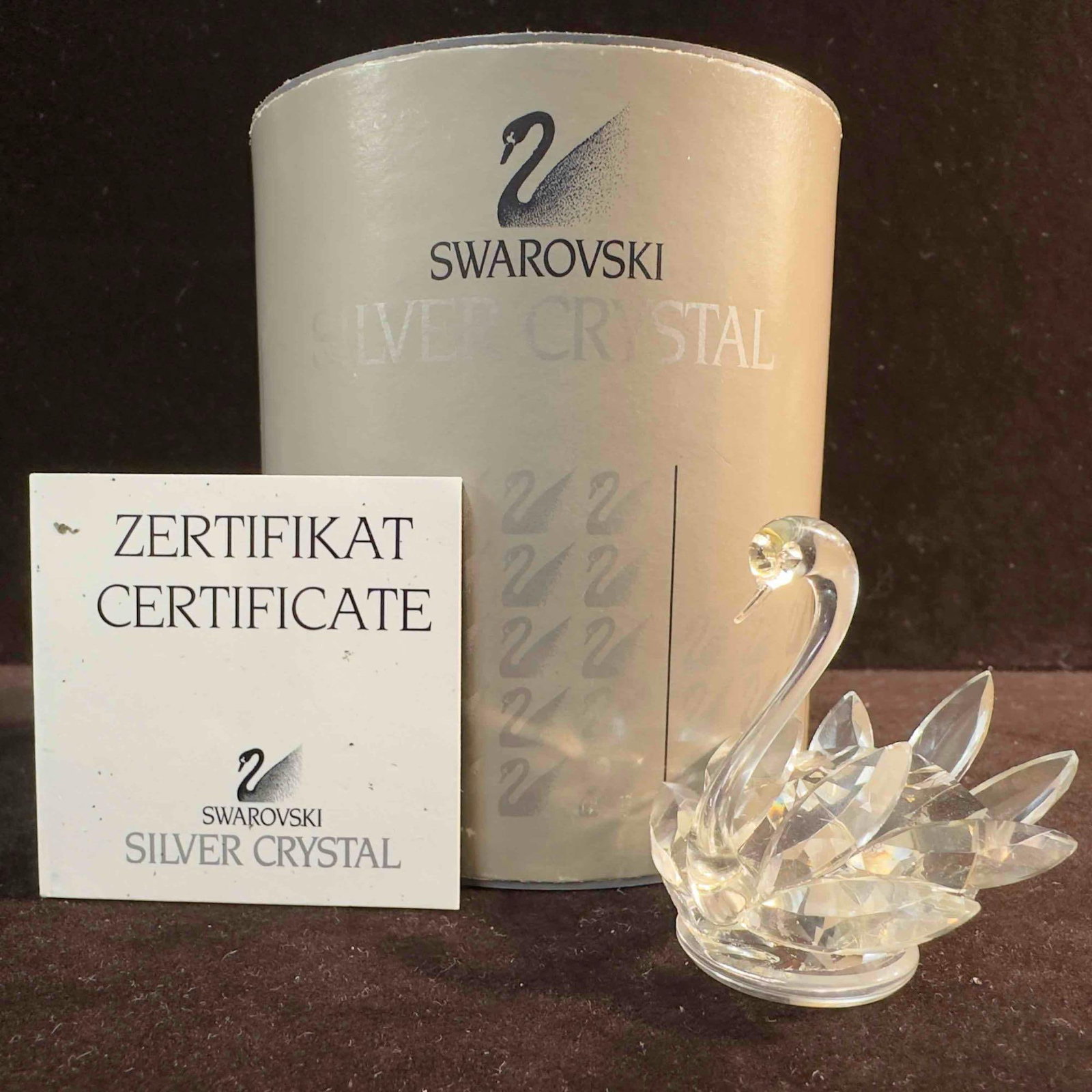 Swarovski Crystal Swan Figurine 7633 NR 050: Swarovski Crystal Figurine Swan. This figure is a beautiful crystal glass art piece featuring a Swan from Swarovski Crystal. The item features a beautifully etched art glass piece showcasing a Swan. T