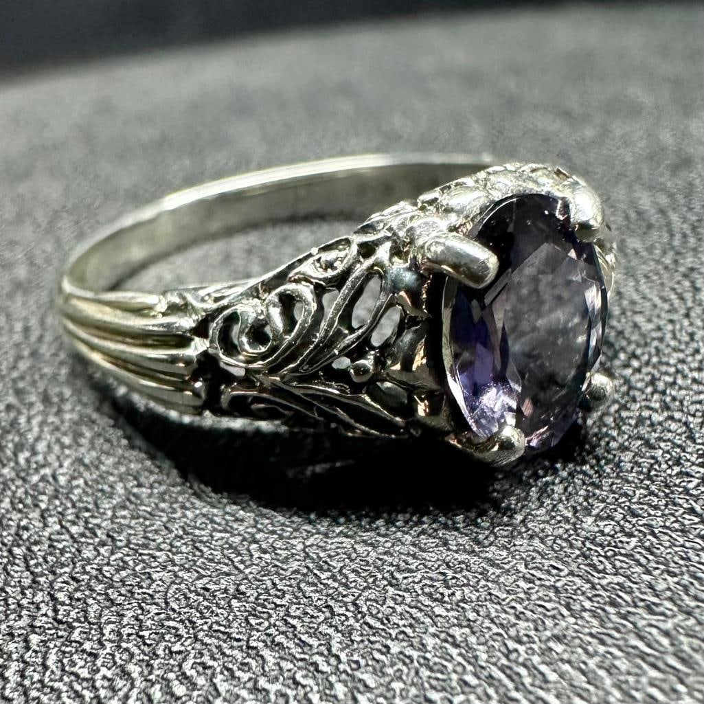 Sterling Tanzanite Filigree Ring: This piece of jewelry has been tested and researched prior to listing. Please view all our pictures they are part of our description. DETAILS: Metal - Sterling Silver Color - Silver Stones - Tanzanite