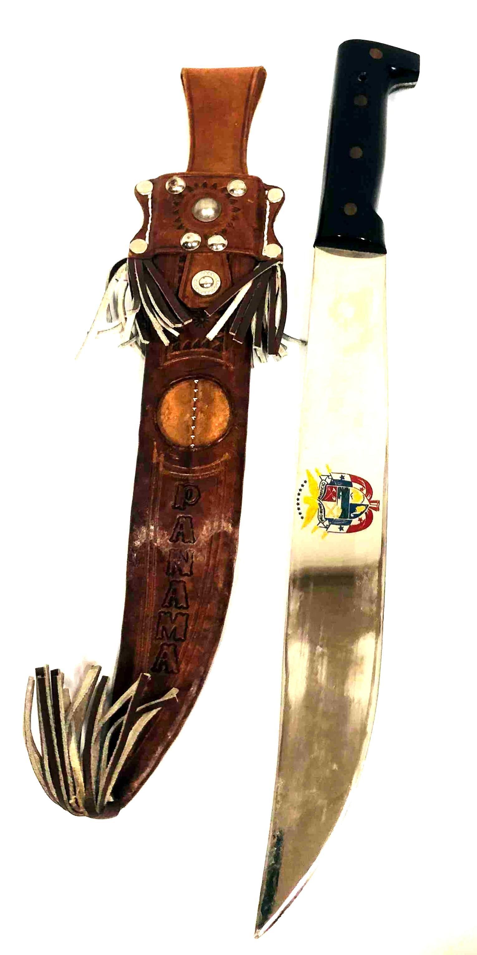 Machete With Arms Of Panama Emblem & Decorative Scabbard Made In El Salvador: This lot contains Machete With Arms Of Panama Emblem & Decorative Scabbard Made In El Salvador. It is approx 17" x 3 1/4" and it weighs about 0.9lbs. Overall the Machete & Scabbard are
