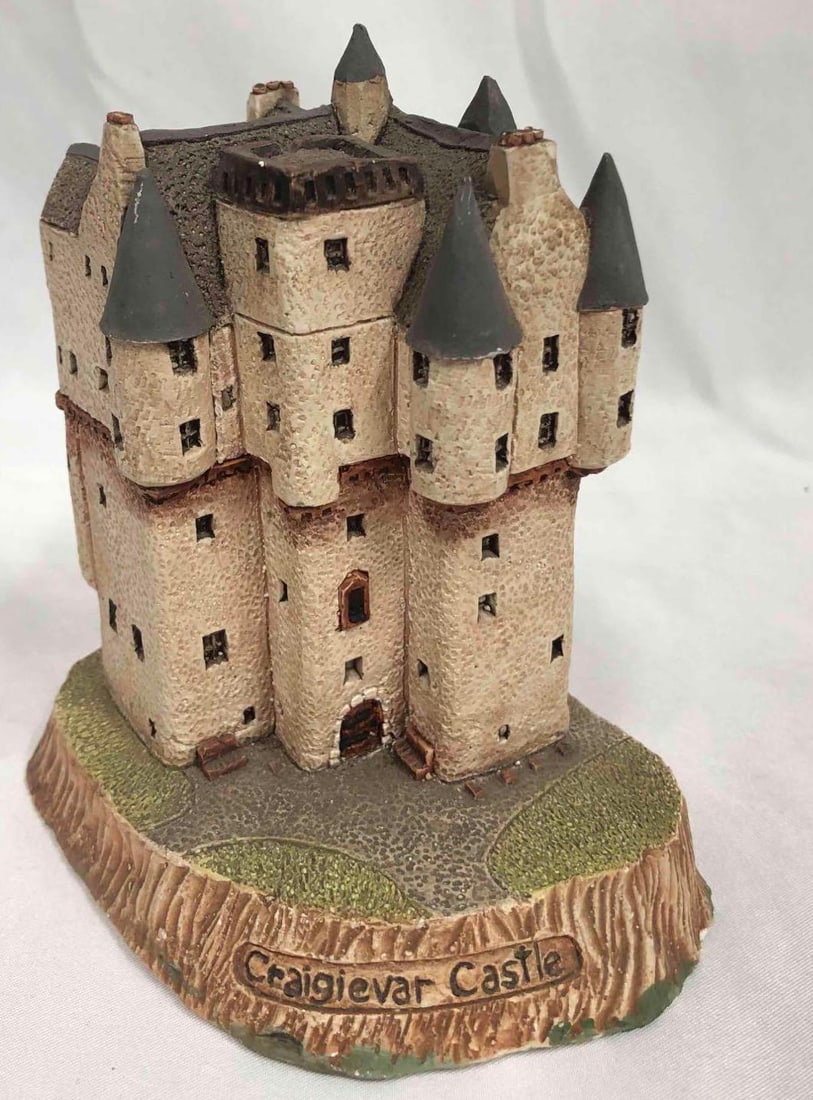 Hand Made Craigievar Castle Statue: This lot contains a handmade Craigievar Castle statue. The statue was made in Scotland by Cameron B. Douglas. The Craigievar castle was originally constructed in 1626 and was sold to the national trus