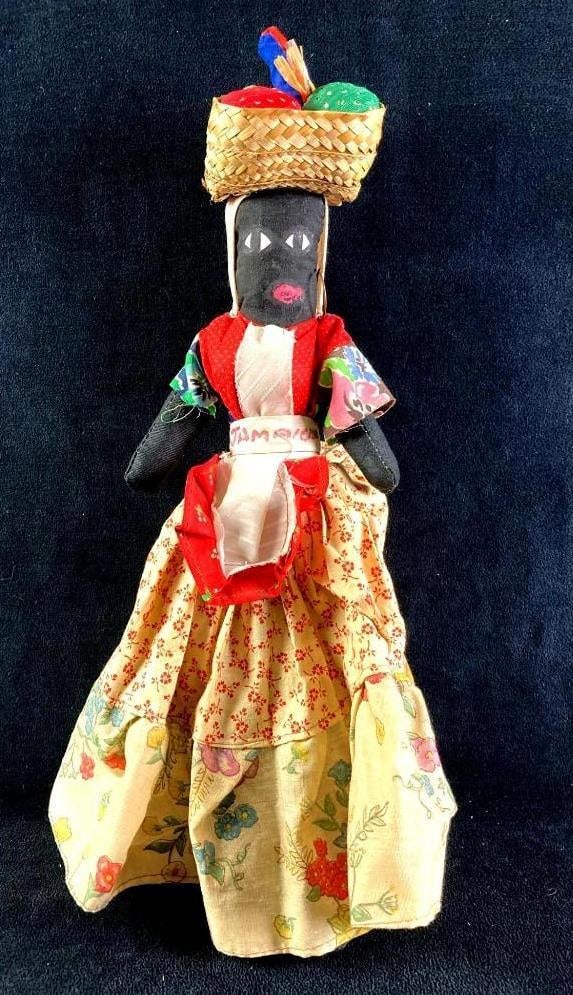 Vintage Handsewn Doll from Jamaica: Vintage Handsewn Doll from Jamaica. Condition is used and see photographs for additional details. The hand-sewn doll is in good shape, it has a waistband that reads "Jamaica." The dress the do