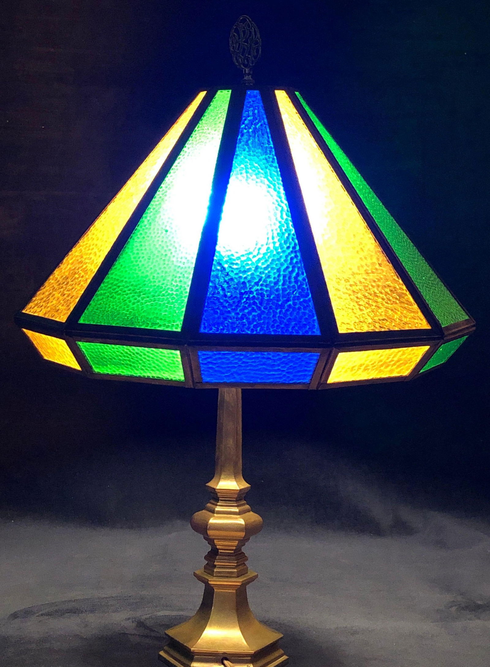 Vintage MCM Textured Glass & Brass Lamp: This lot contains Vintage MCM Textured Stained Glass Lamp with Brass Candlestick Base. It is approx 25-1/2" x 15" x 15" and weighs about 12.0lbs. Overall the Lamp is in good used condition