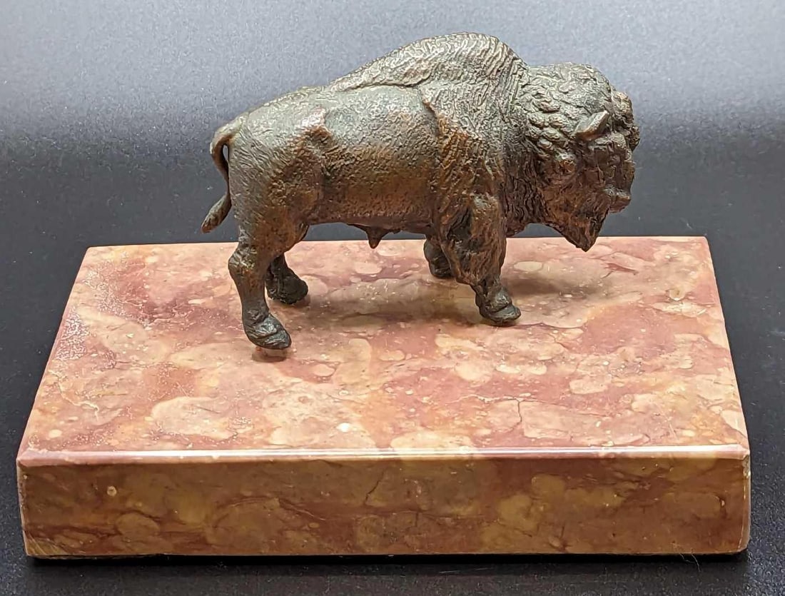 Vintage Buffalo Figurine On Marble: Vintage Buffalo Figurine On Marble. This is approx 5 1/2" x 3 3/8" x 3 1/2" and it weighs 2.49lbs. The metal figurine has slight wear.