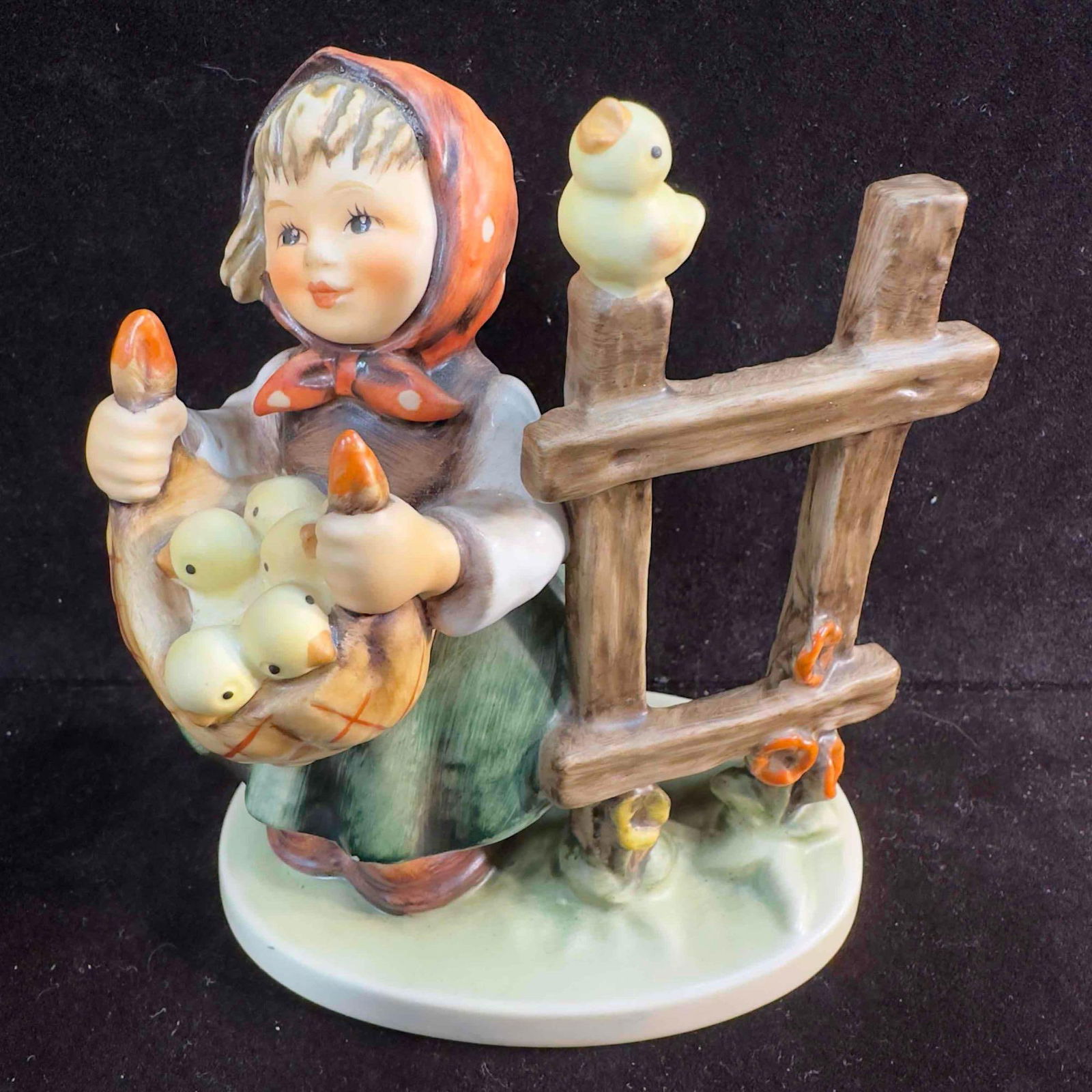 Goebel Hummel Figurine Chicken Licken #385: Goebel Hummel Figurine "Chicken Licken" #385. This quality figure features a woman with some chicks from Goebel Hummel. The item features a beautifully etched porcelain piece showcasing a scen