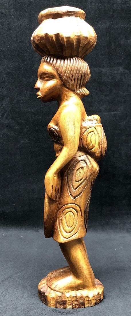 Vintage Carved Wood Sculpture - Woman Baby Basket: Vintage Carved Wood Sculpture of Woman Carrying Baby and Basket. Item is approximately 17" x 4-1/2" x 3-1/4" and weighs 2.3lbs. Overall the Carved Wood Sculpture in good used condition wit
