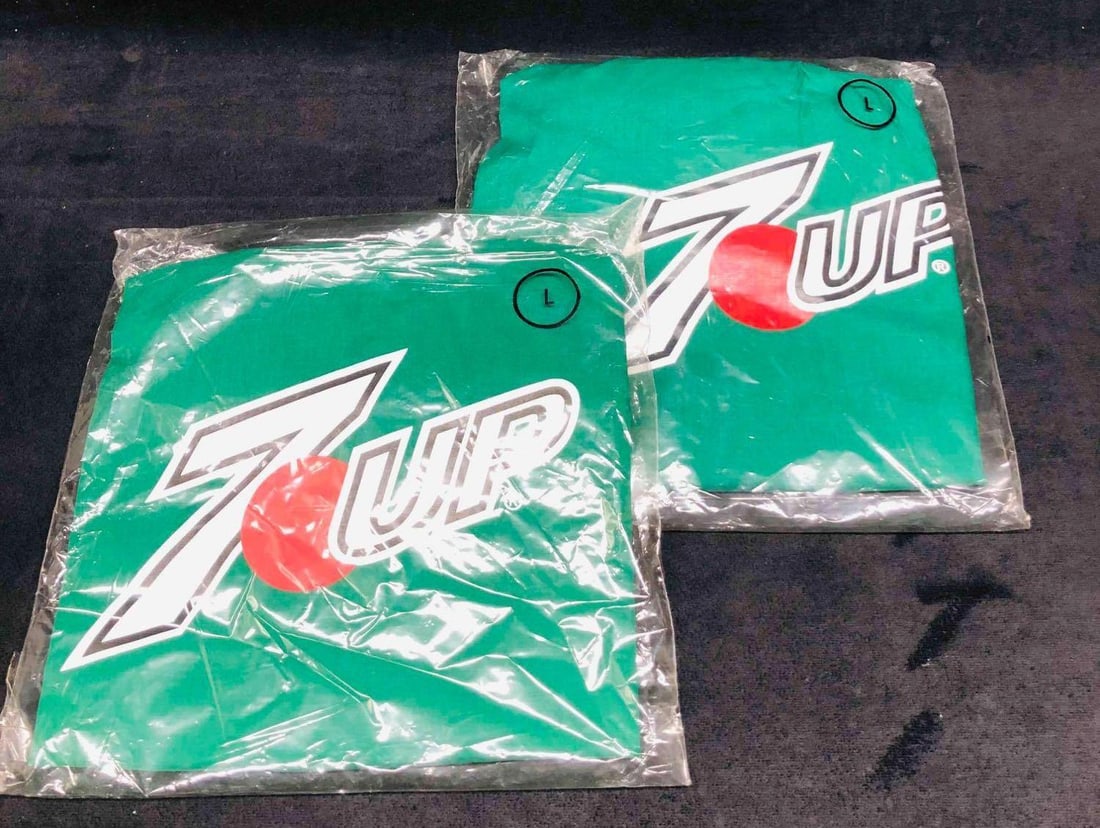 Two Vintage Pairs Of Sealed Size Large 7Up Shorts: This lot contains Two Pairs Of Sealed Size Large 7Up Shorts. Each pair in the sealed bag is approx 9" x 9" and together the two pairs weigh 0.4lbs. Overall the shorts are in good used conditio