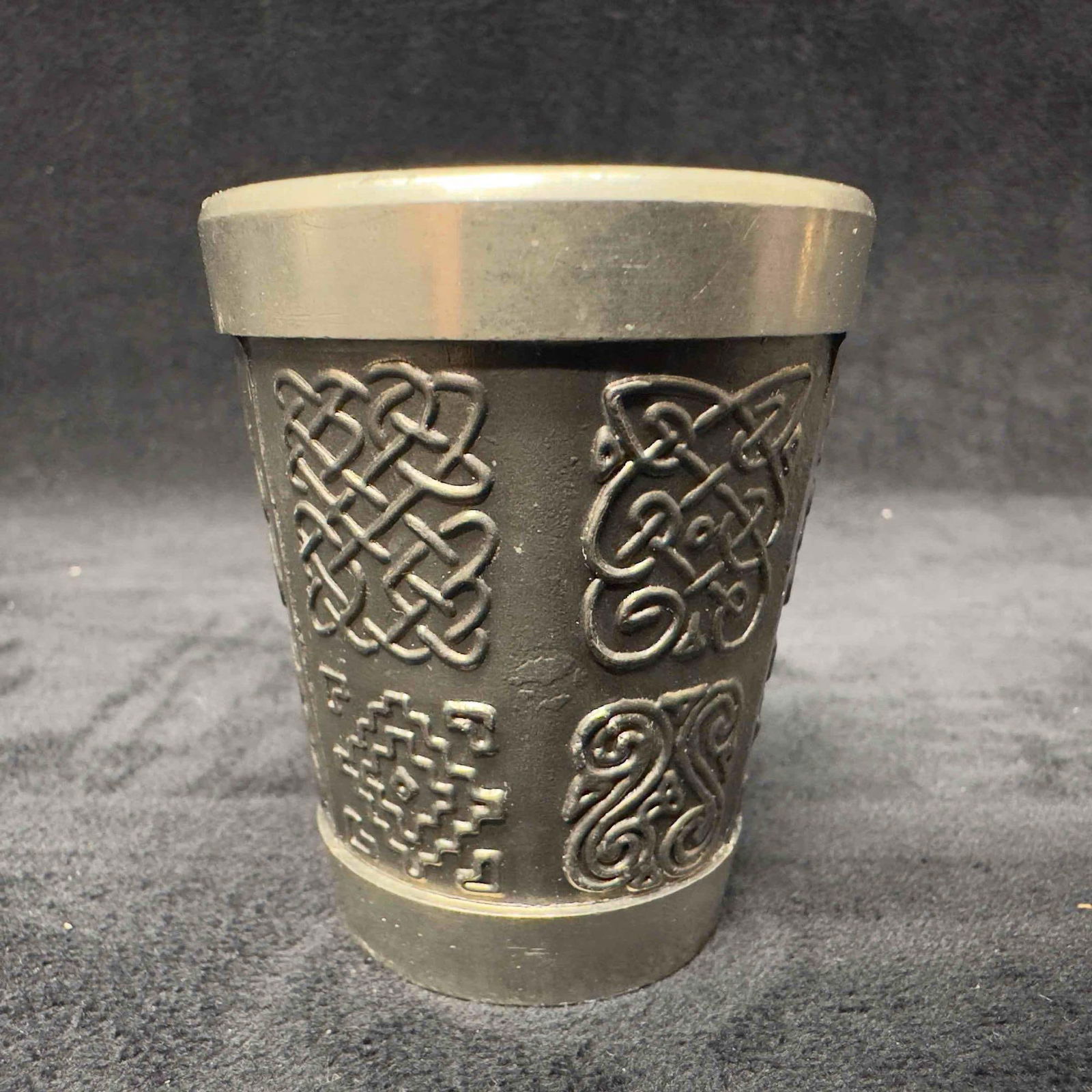 Mullingar Pewter 1 Oz Shot Glass Celtic Designs Made In Ireland: Mullingar Pewter 1 Oz Shot Glass Celtic Designs Made In Ireland. This pewter shot glass has a Celtic design on the outside. Mullingar Pewter Ireland marking on the bottom of the shot glass. This item