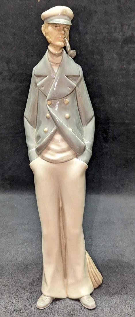 Retired Lladro Sea Captain Figurine: Retired Lladro Sea Captain Figurine. This was designed by Salvador Furio and was released from the year 1970 to the year 1994. The figurine is approx 4" x 3 1/2" x 15" and it weighs 2.20 l